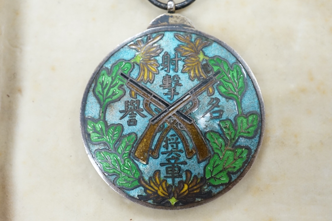 A Chinese Wu Pei Fu Sharpshooter enamelled medal, c.1915, with portrait of Wu Pei Fu to the obverse and crossed foliated rifles to the reverse, 40cm diameter
